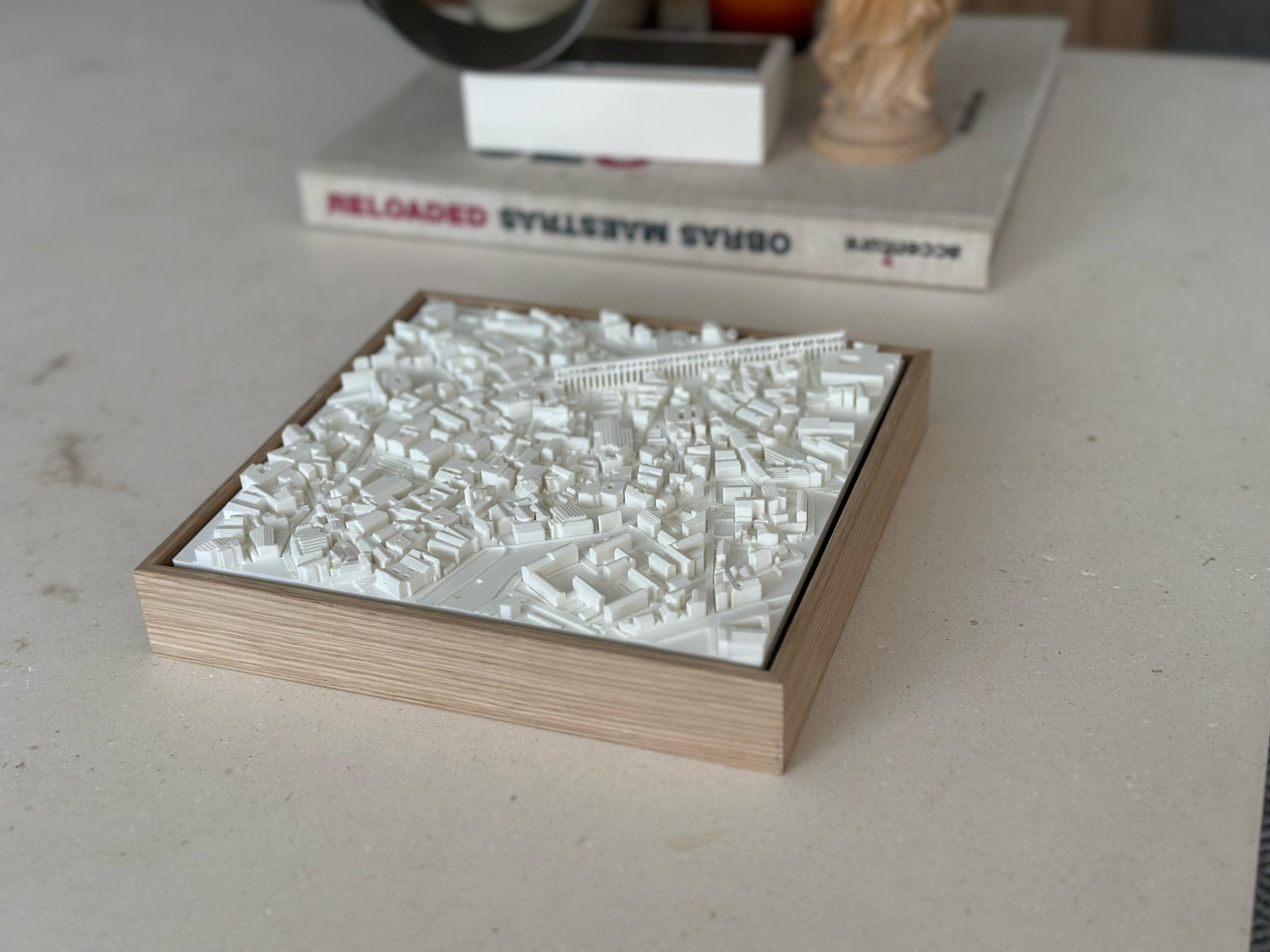 3D city map wall art in a wooden frame, modern urban decor on a light surface