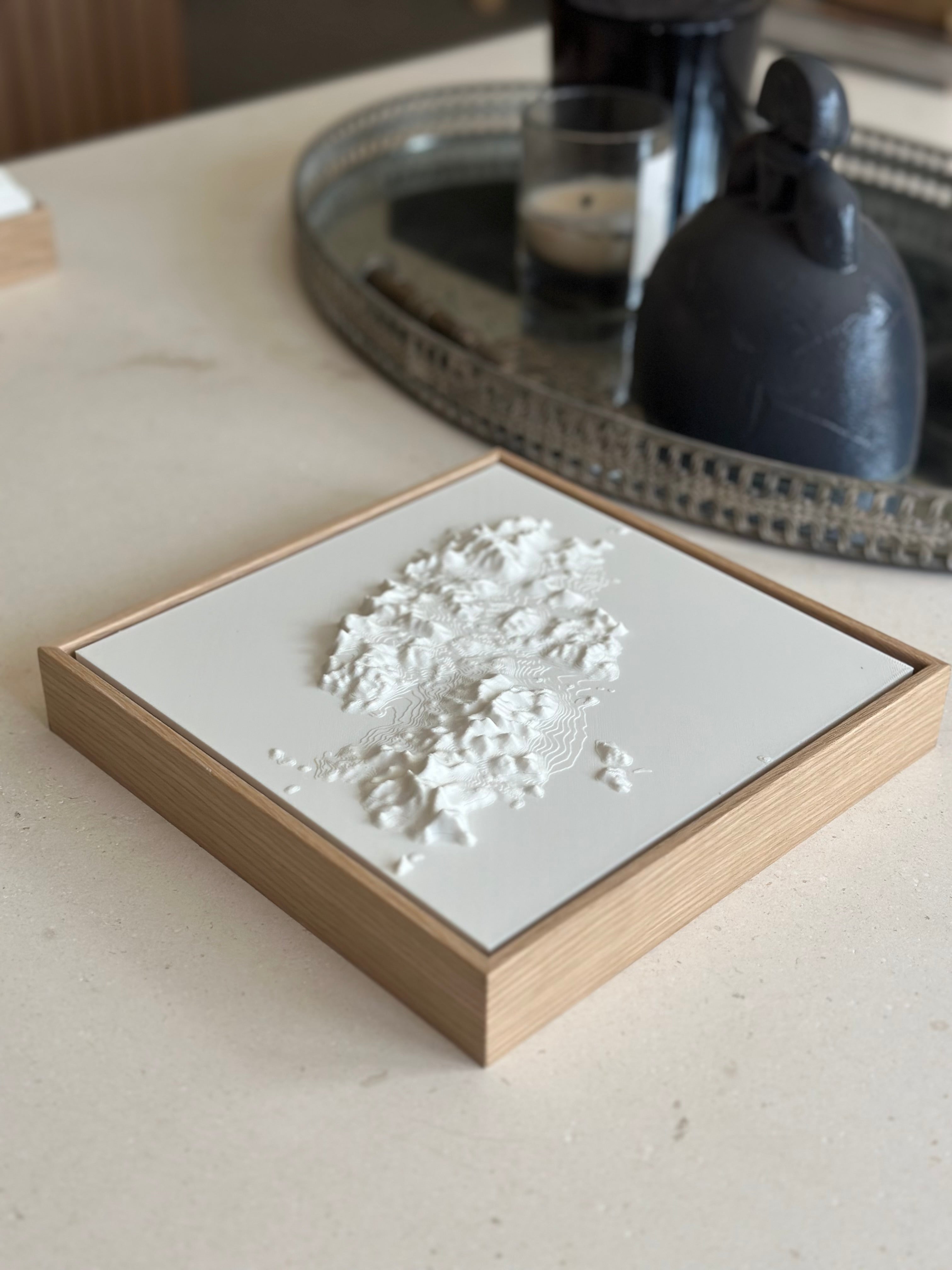 3D city map wall art in wood frame on modern coffee table, minimalist home decor