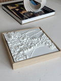 3D city map art in a wooden frame on a table, modern urban wall decor