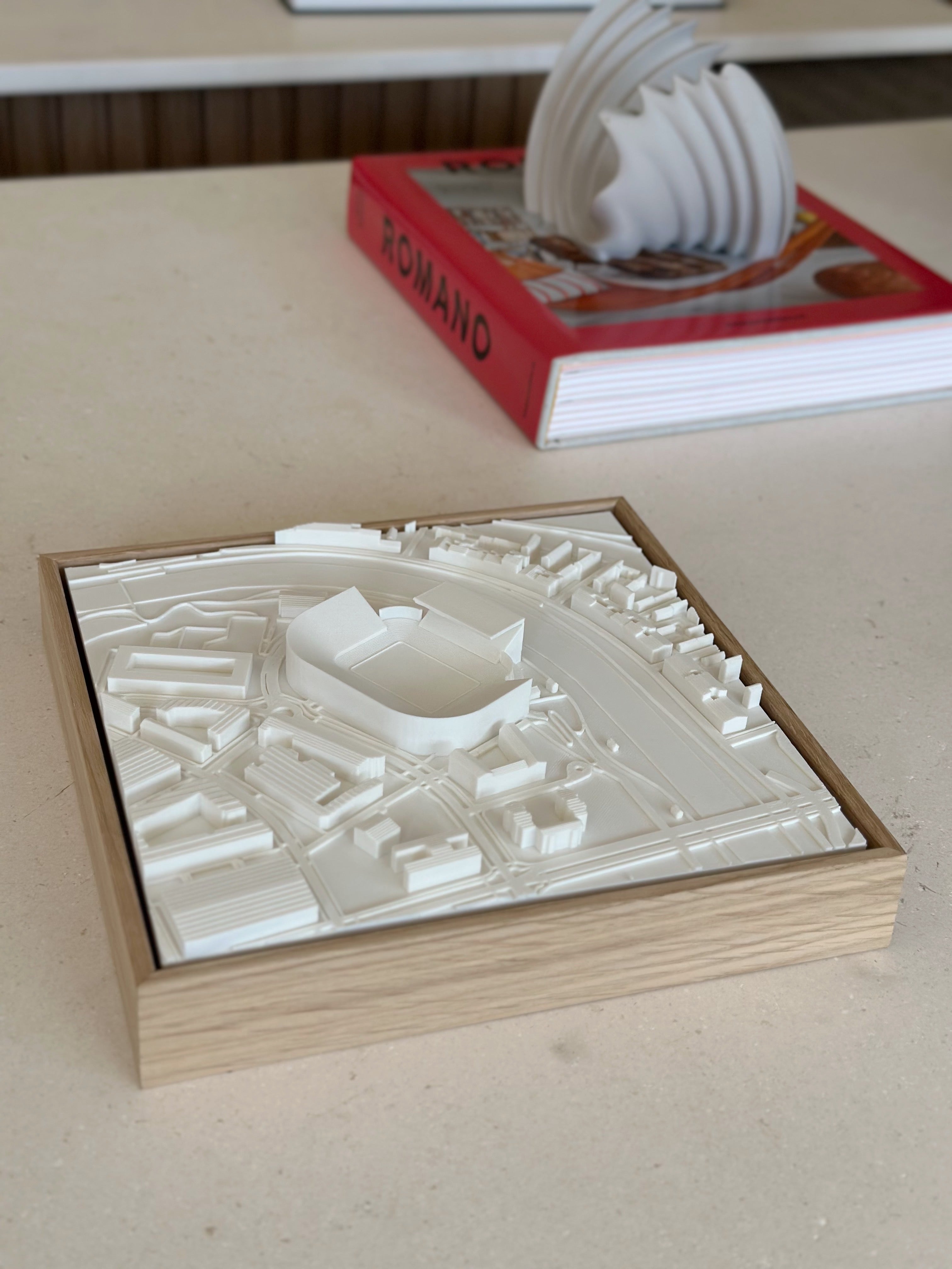 3D city map wall art in a wooden frame, modern architectural decor on a light surface