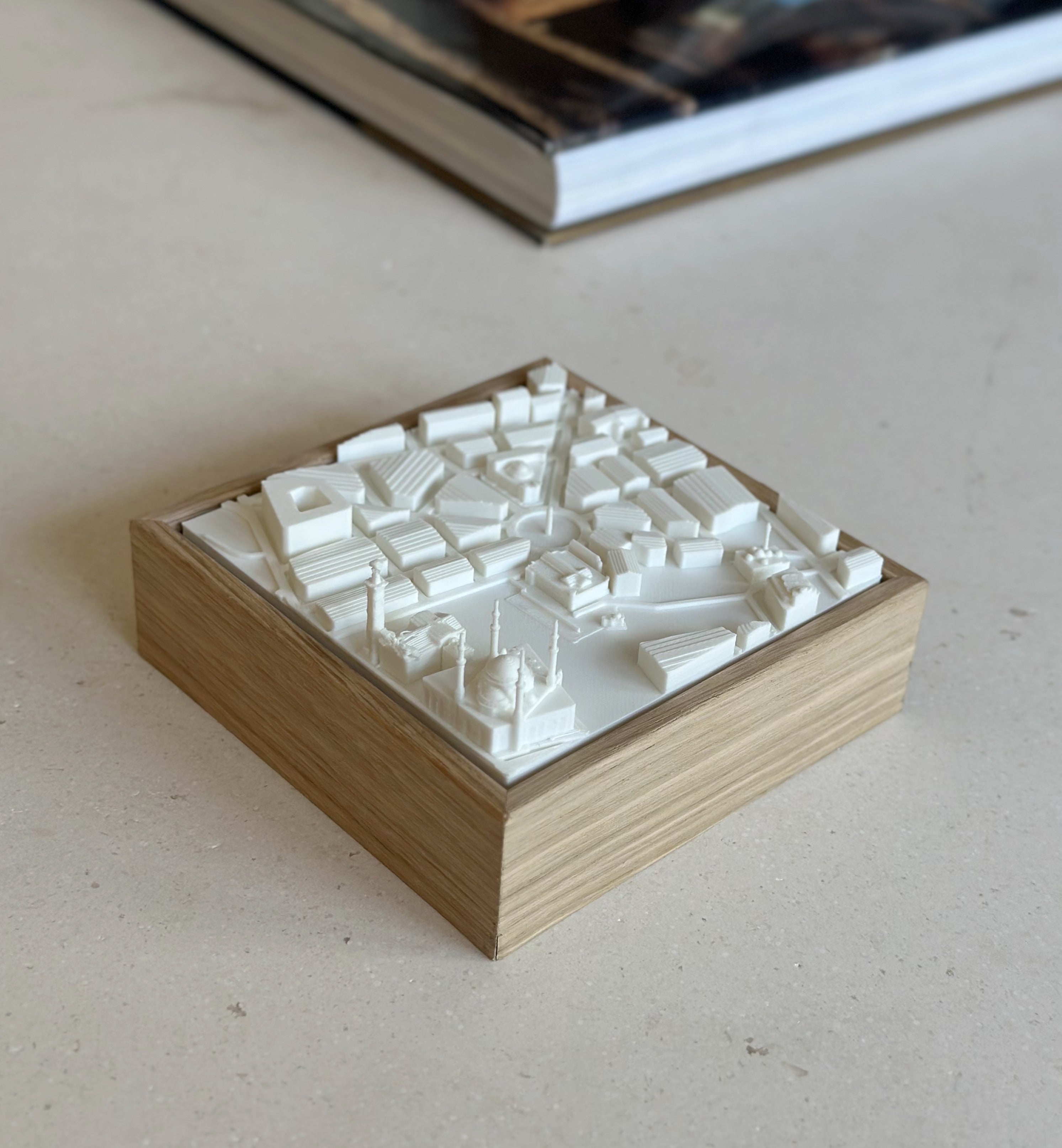 3D city map wall art with white buildings on wooden base, modern home decor