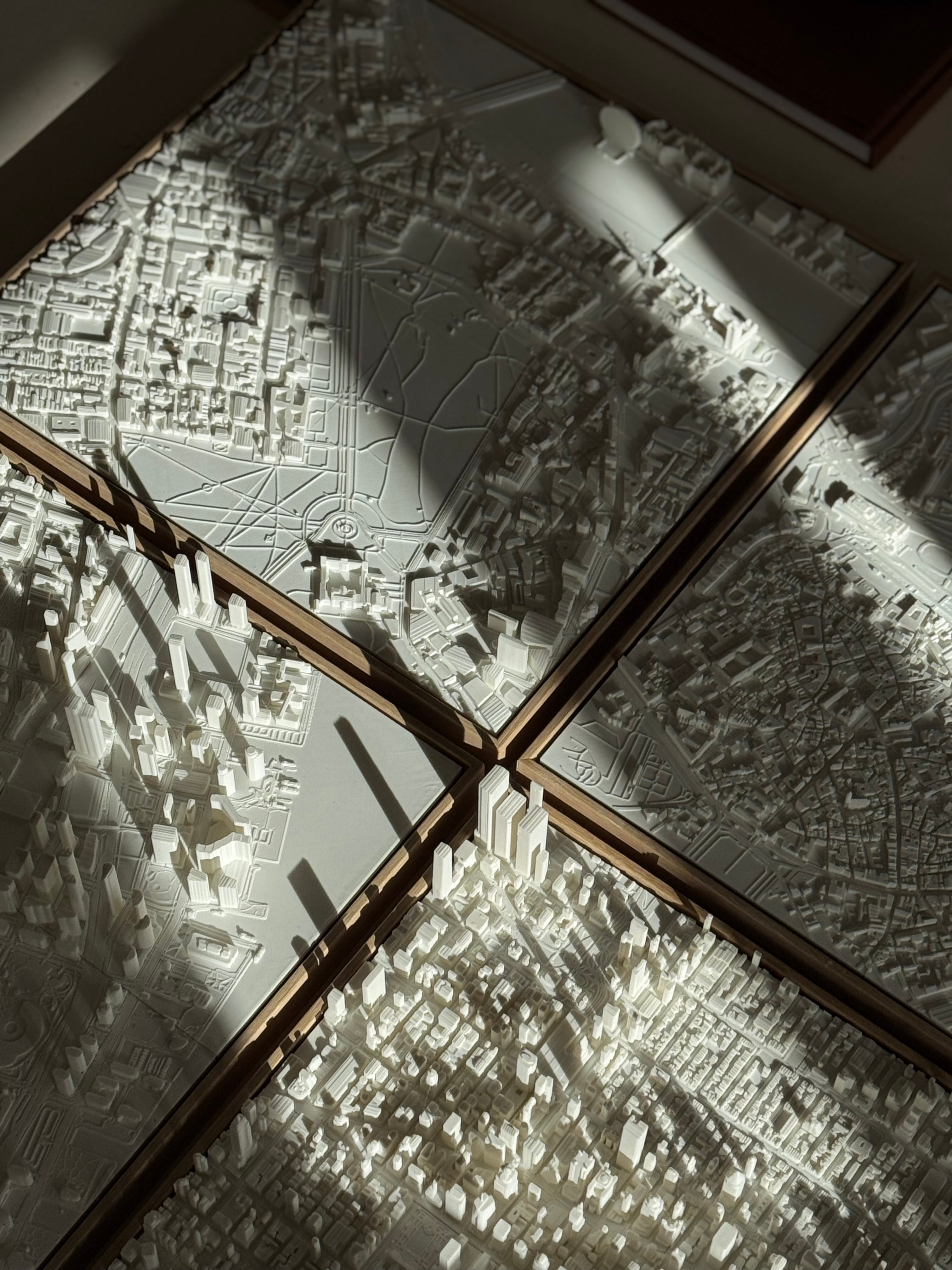 Set of white 3D city map wall art panels with intricate urban street and building details