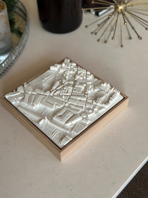 3D city map wall art in a wooden frame, modern city map decor on a tabletop
