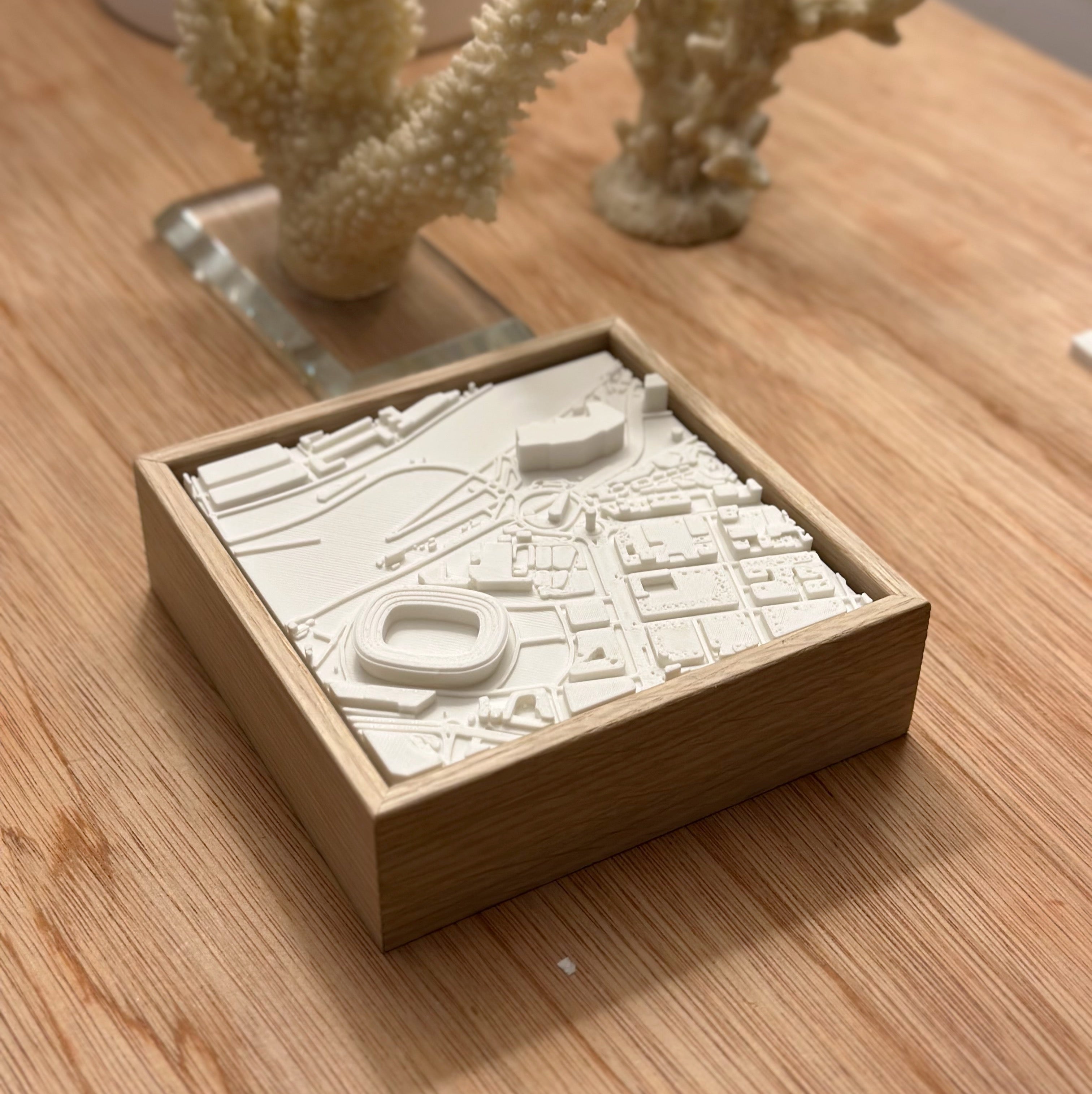 3D city map wall art in wooden frame on a wooden surface, modern home decor