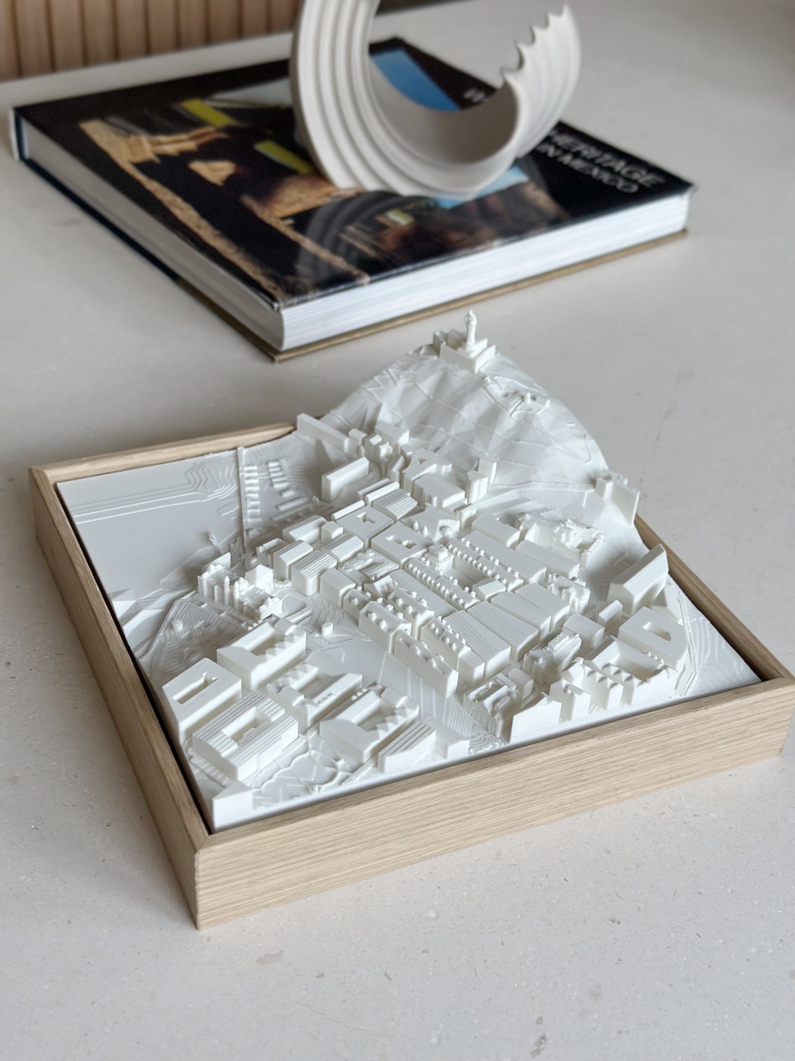 3D city map wall art in a wooden frame, modern decor on a light tabletop