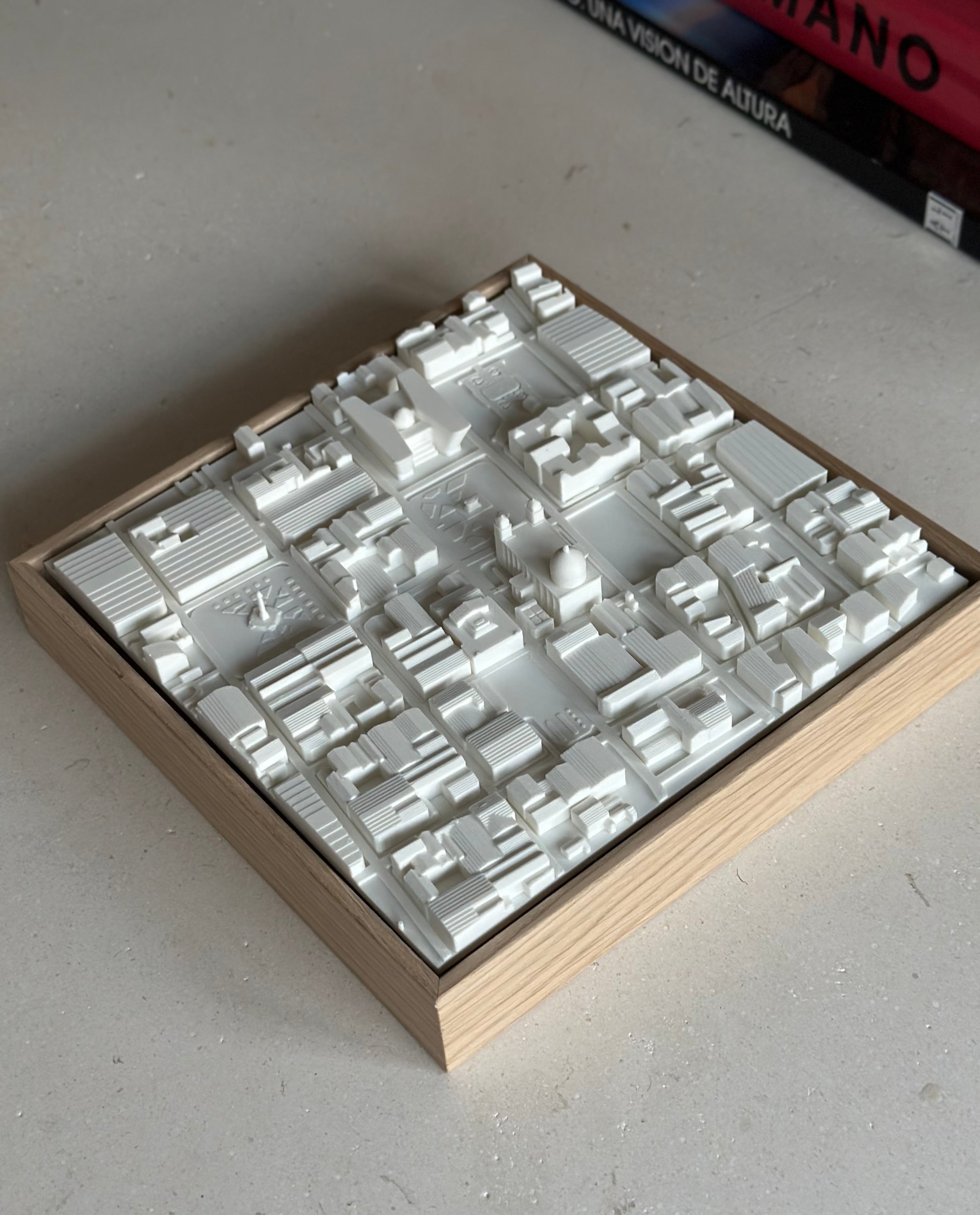3D city map art in white with wooden frame, modern urban decor on light surface
