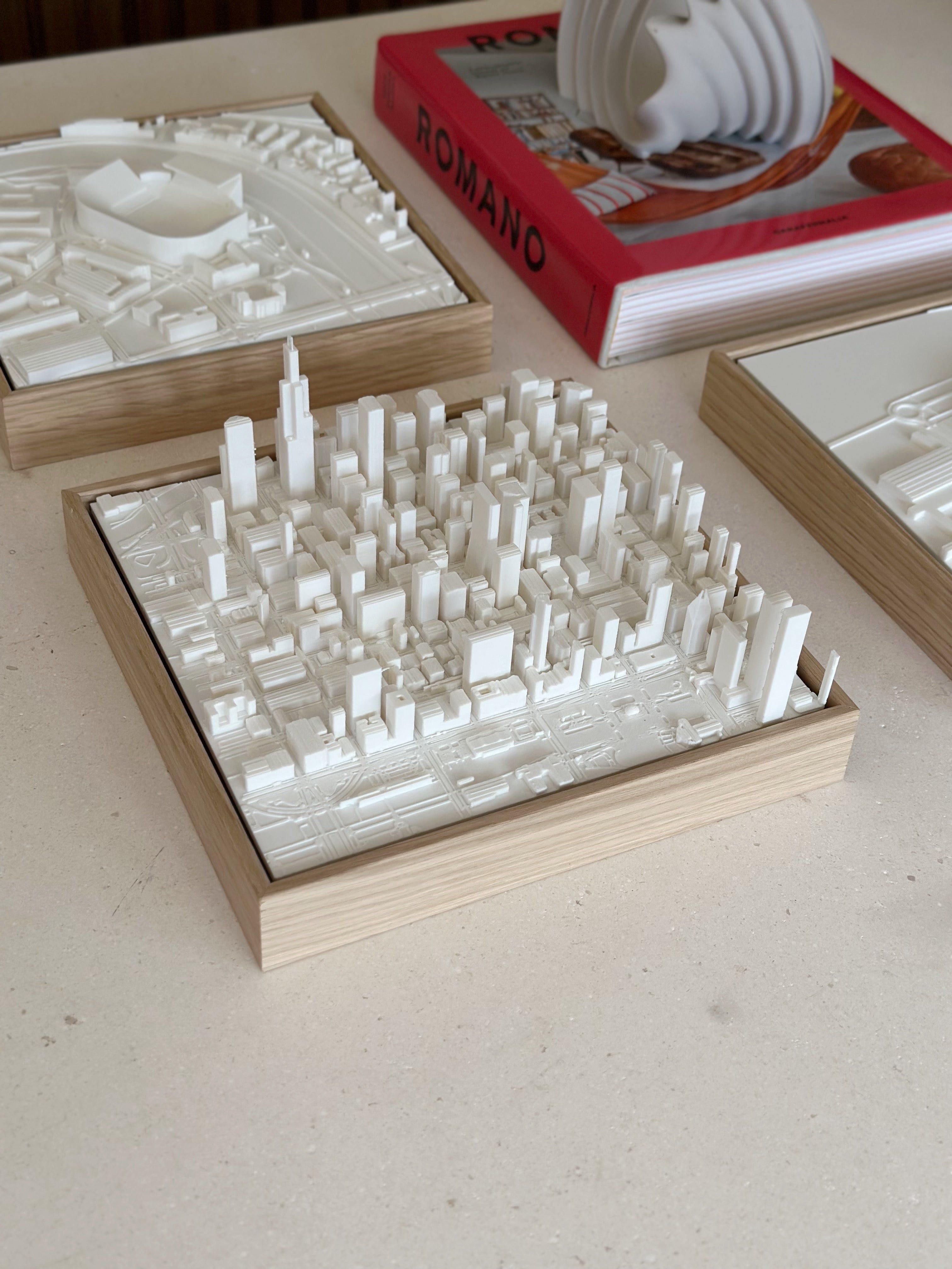 3D city map wall art with white skyscrapers on a wooden frame, modern home decor
