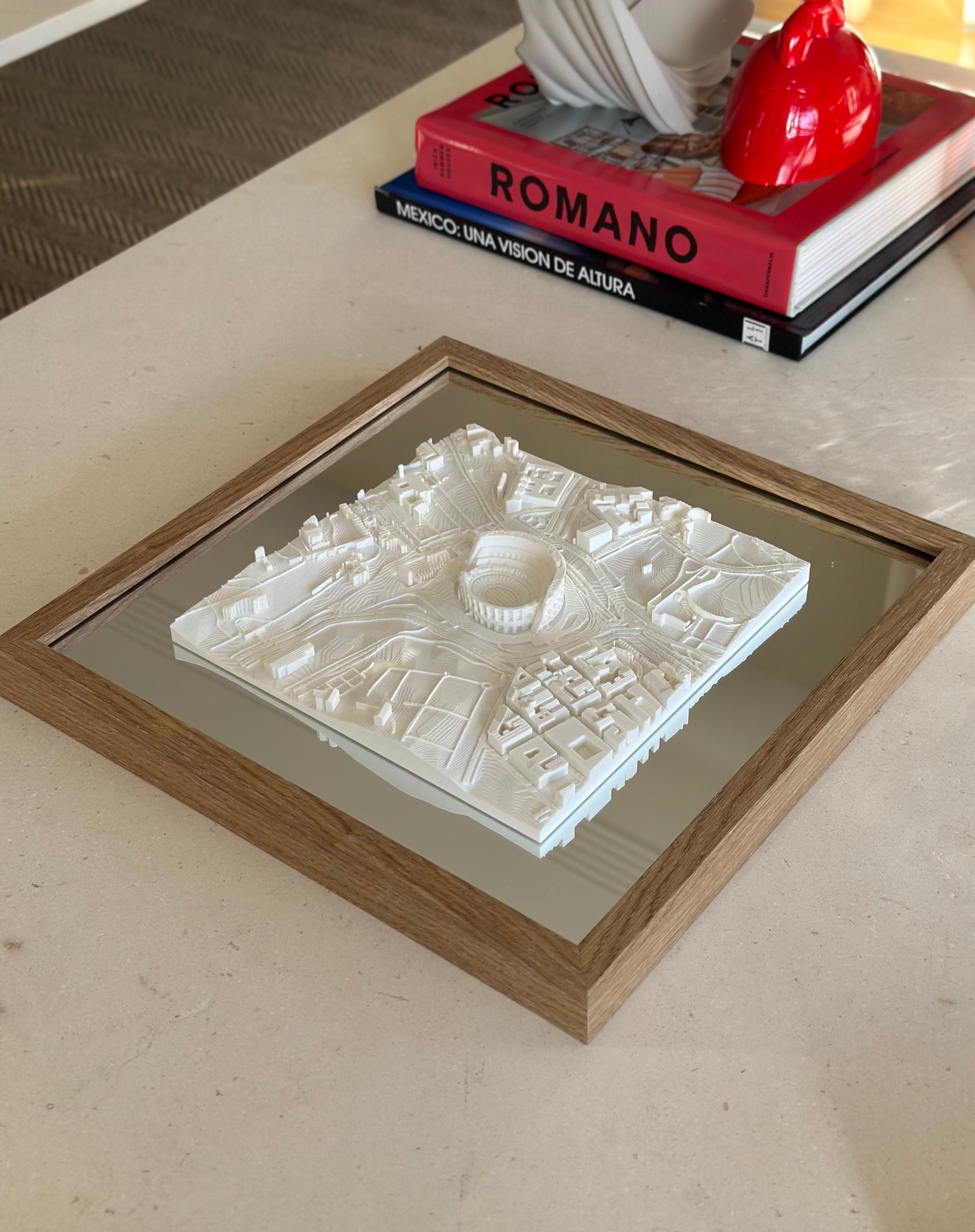 Framed 3D city map art in white on a table, modern decor, architectural gift