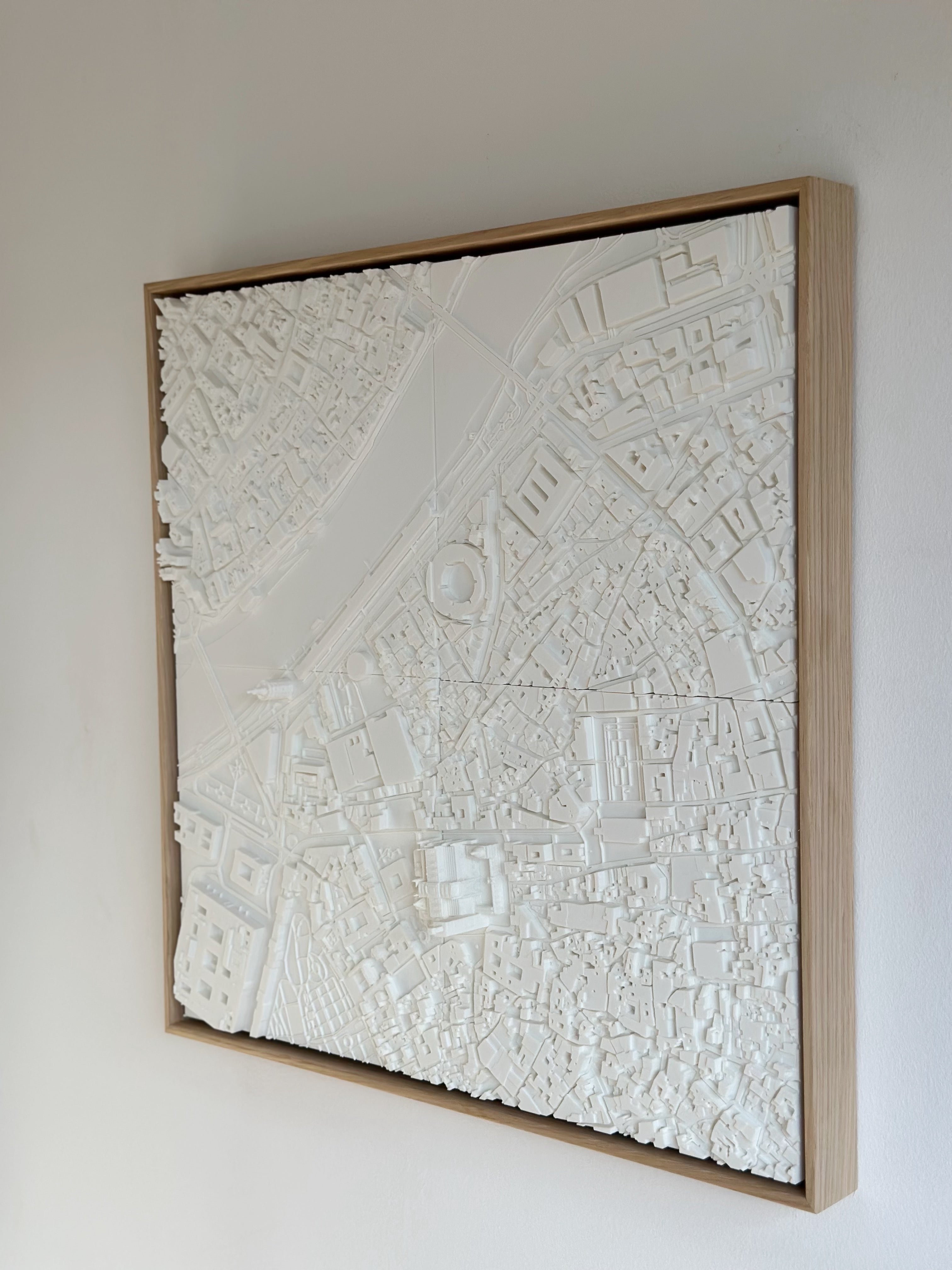 Framed white 3D city map wall art with detailed urban buildings and streets