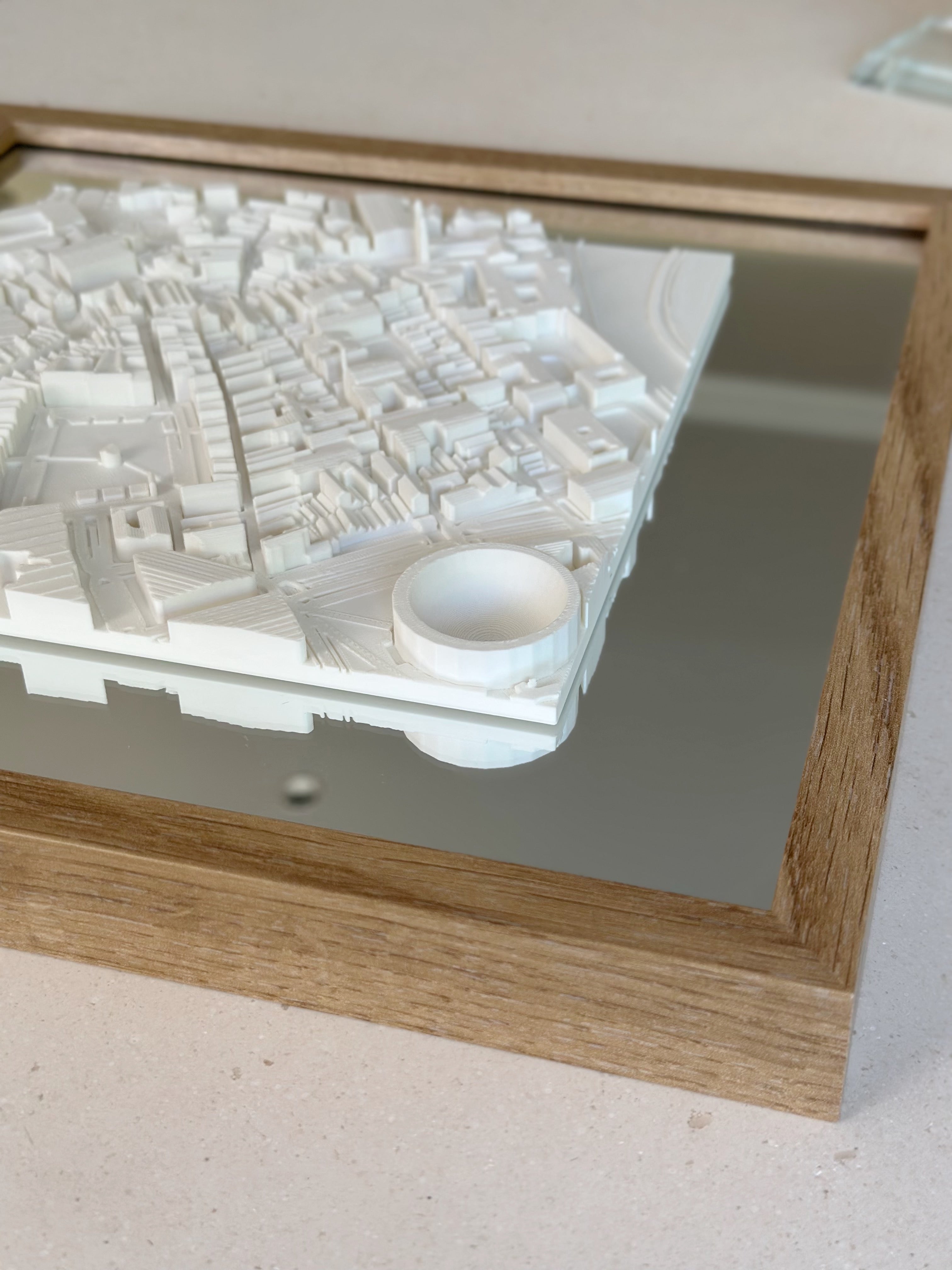 3D city map wall art with white buildings in a wooden frame, modern home decor