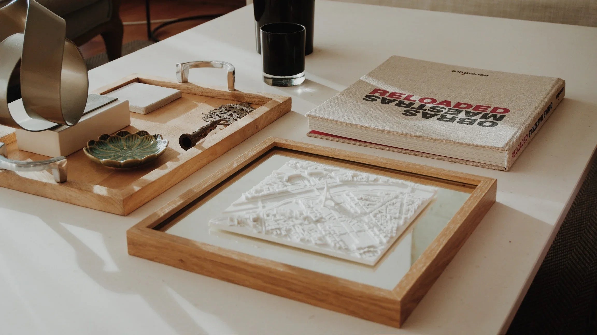 Framed 3D city map decor on a stylish coffee table with modern accessories
