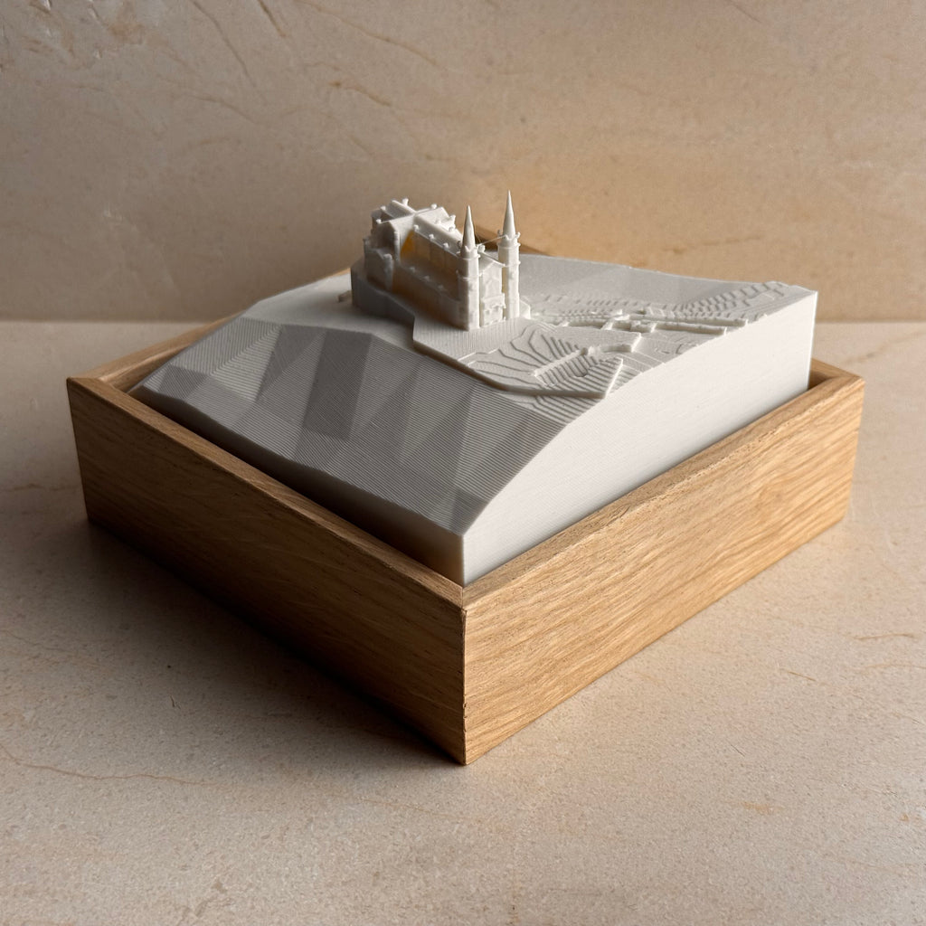 3D topographic map of Covadonga with landmark building in a wooden display frame