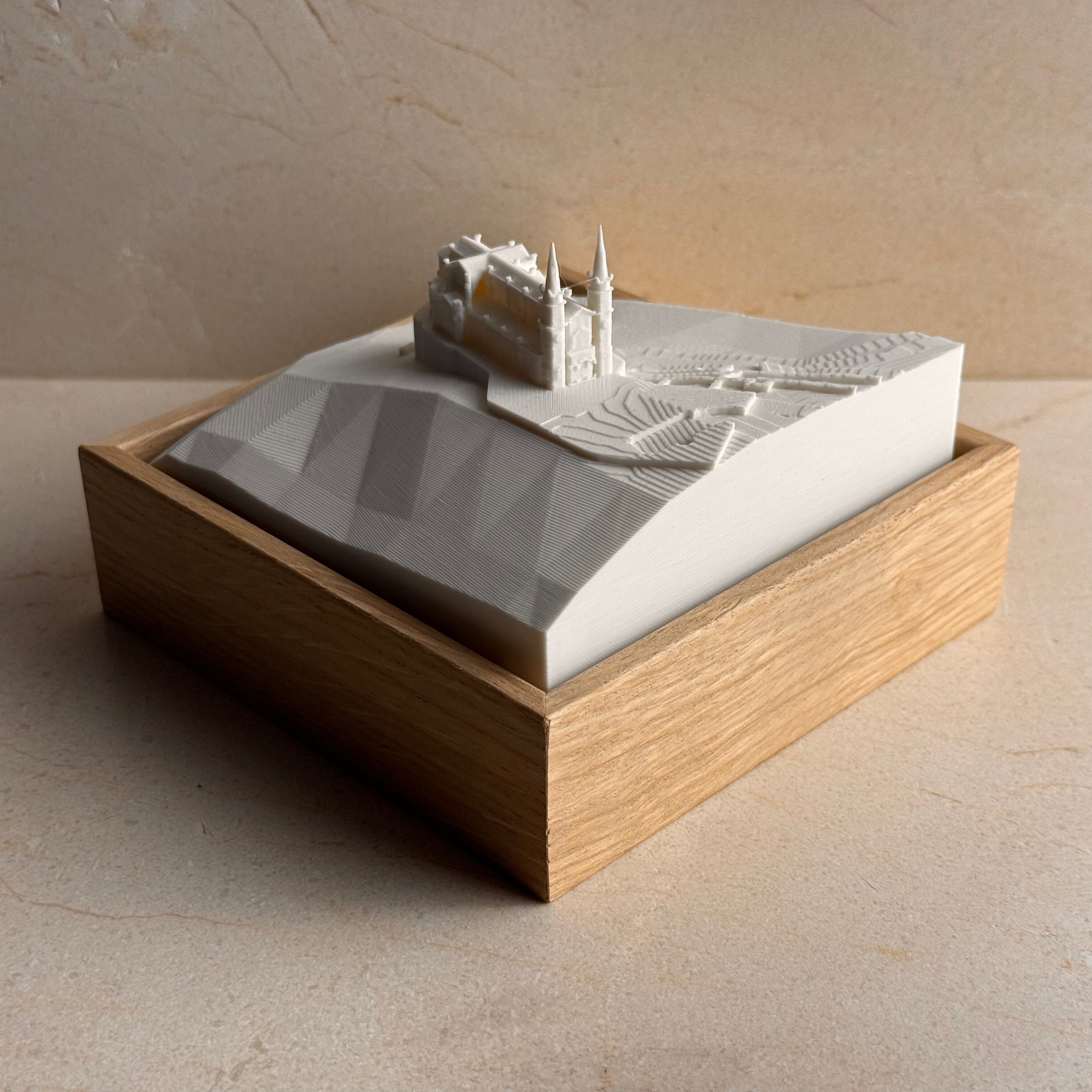 3D topographic map of Covadonga with landmark building in a wooden display frame