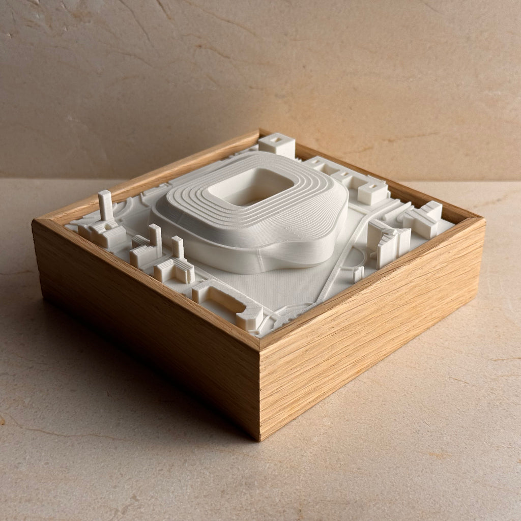 3D city map wall art in a wooden frame featuring detailed architectural structures