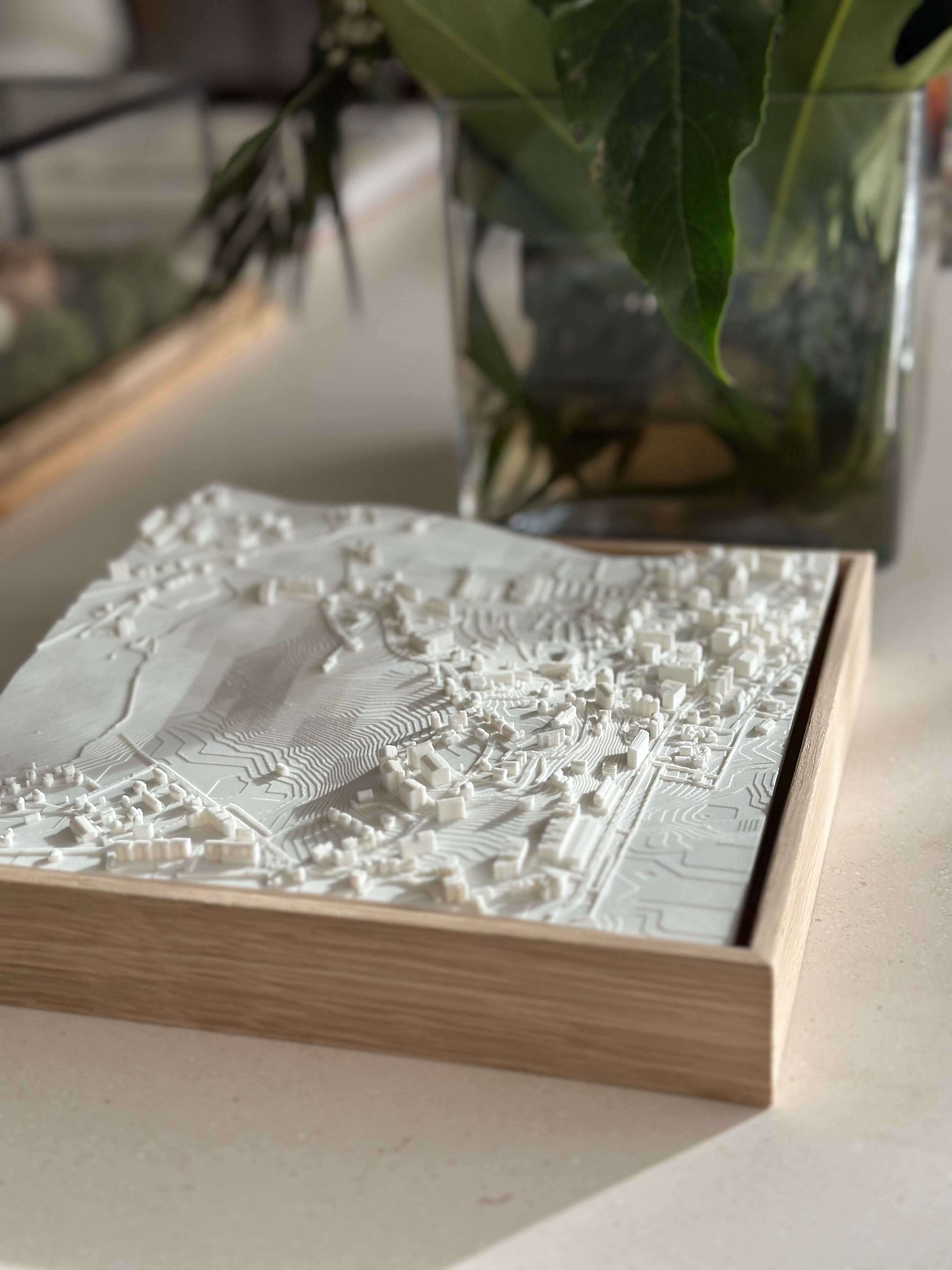 3D city map art in wooden frame, decorative home decor on neutral table