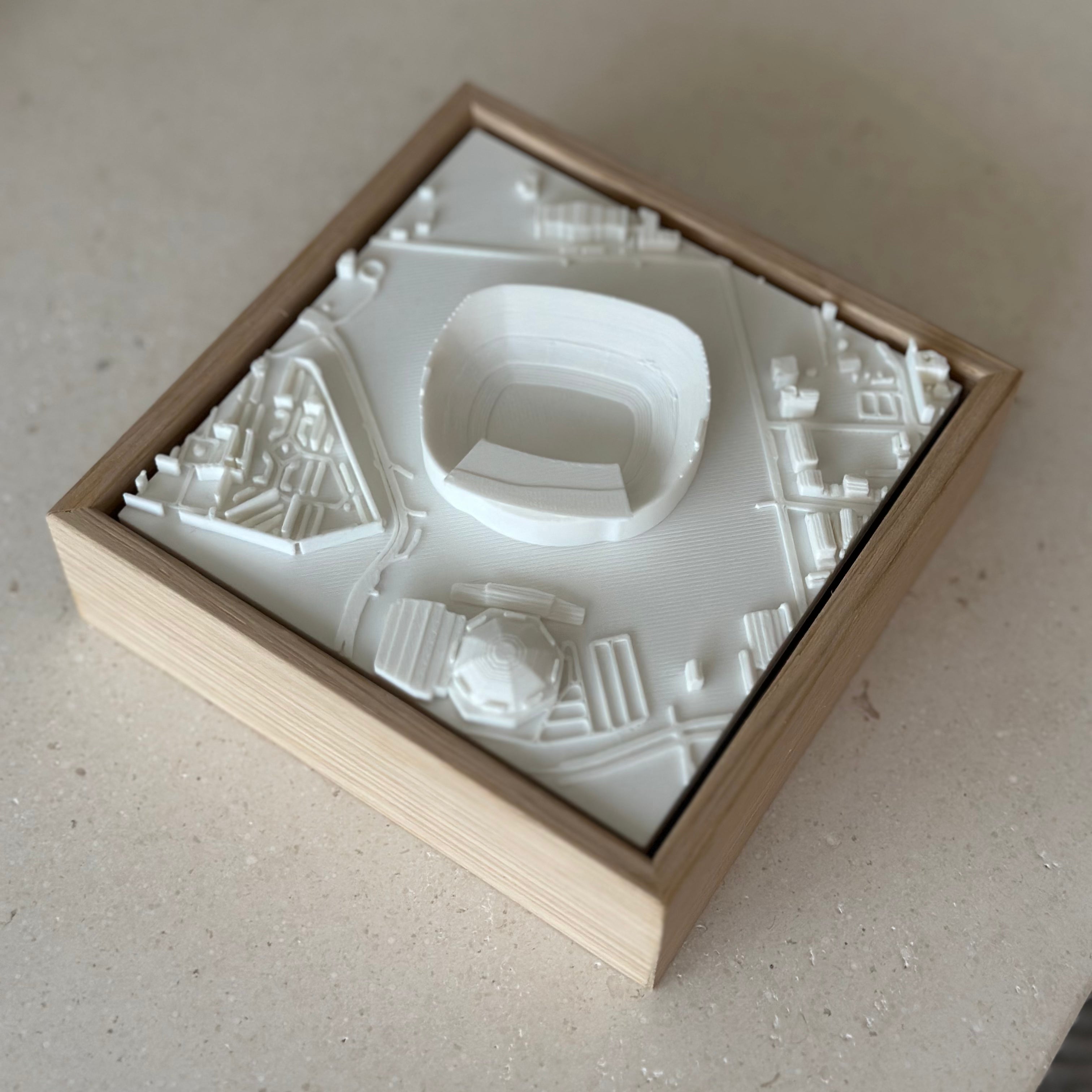 3D city map wall art in wood frame, featuring stadium and urban streets, home decor gift