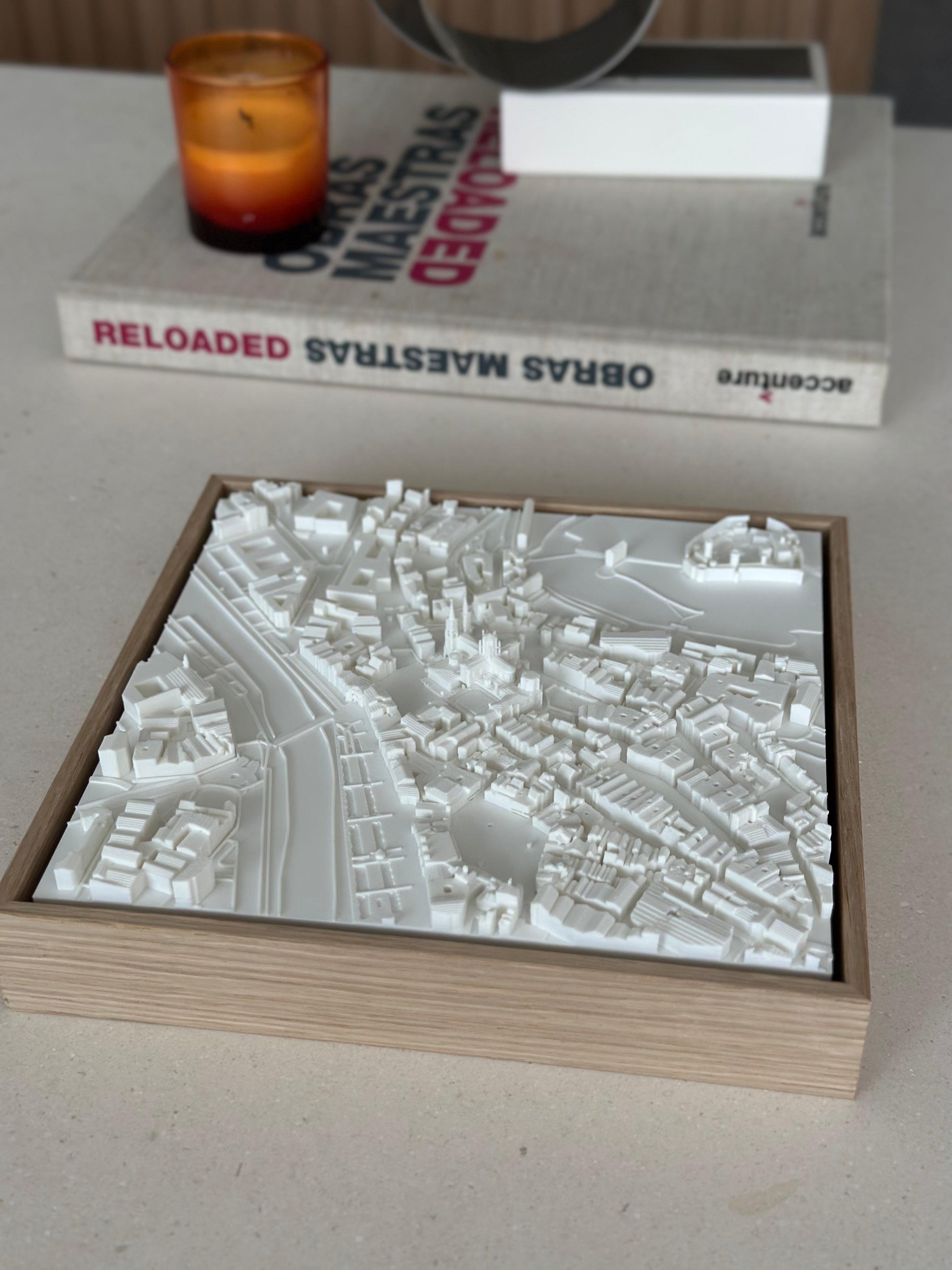 3D city map wall art in a wooden frame on a table, modern home decor