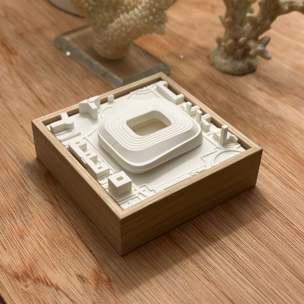 3D city map wall art in a wooden frame on a wooden table, modern home decor