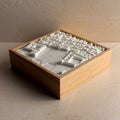 3D city map of Lisbon in white, framed in a wooden box, modern urban wall decor