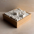 3D city map of Malaga in white on wooden frame, decorative miniature sculpture
