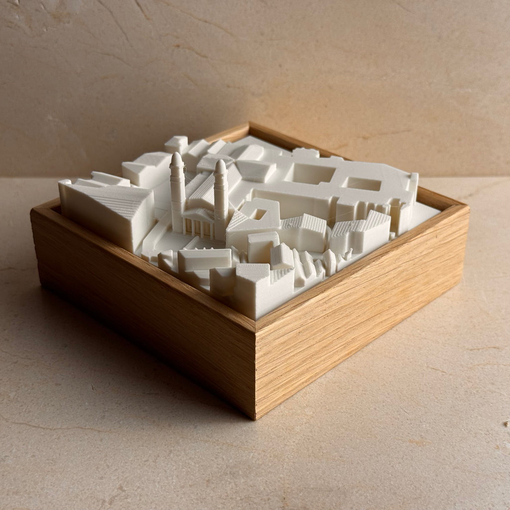 3D city map of Pamplona in white, displayed in a wooden frame, miniature wall decor