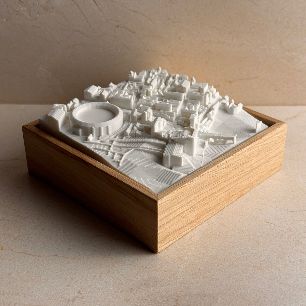 3D city map art with white topographic buildings in a wooden frame, home decor gift