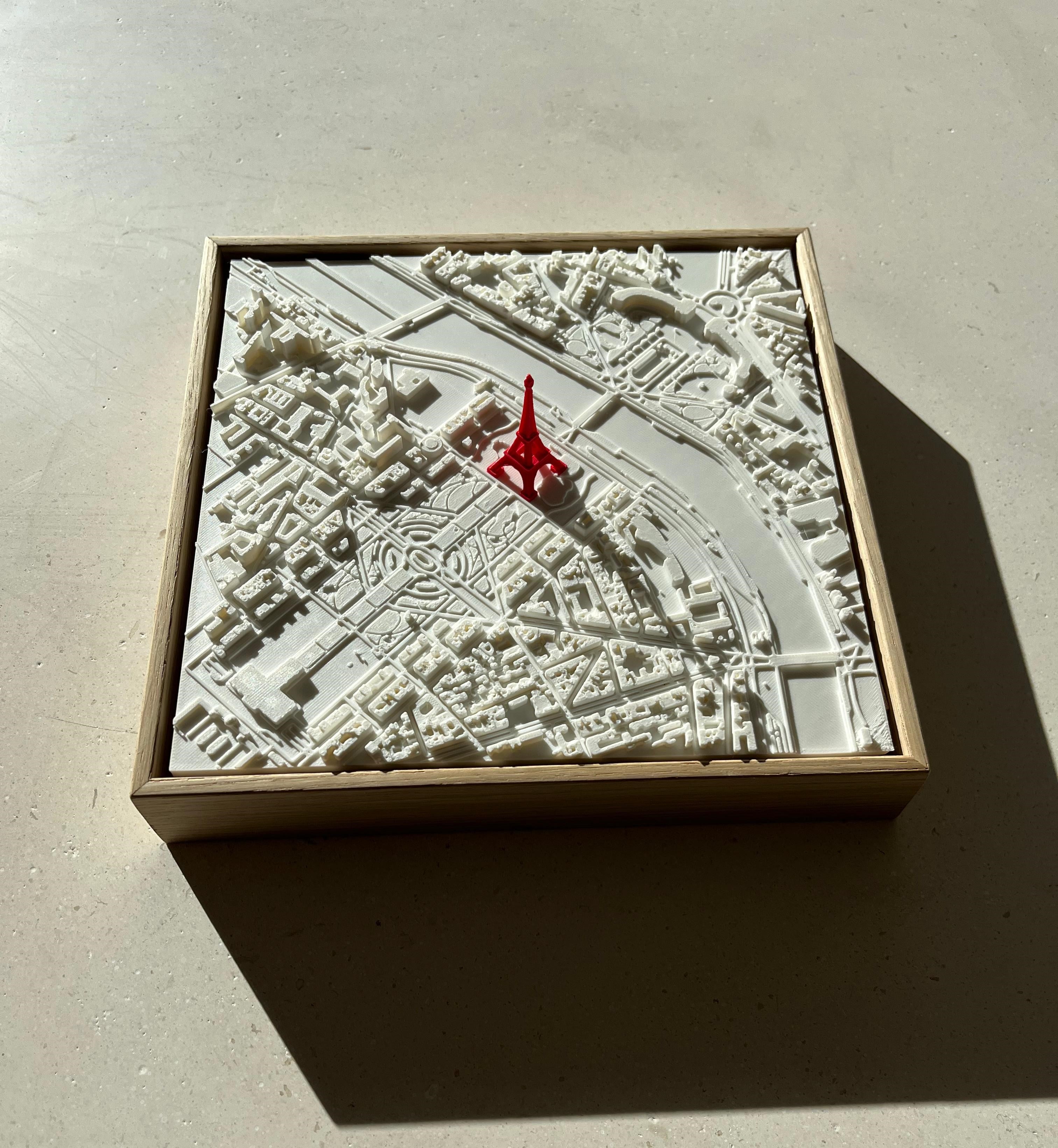 3D city map artwork of Paris with a red Eiffel Tower in a wooden frame
