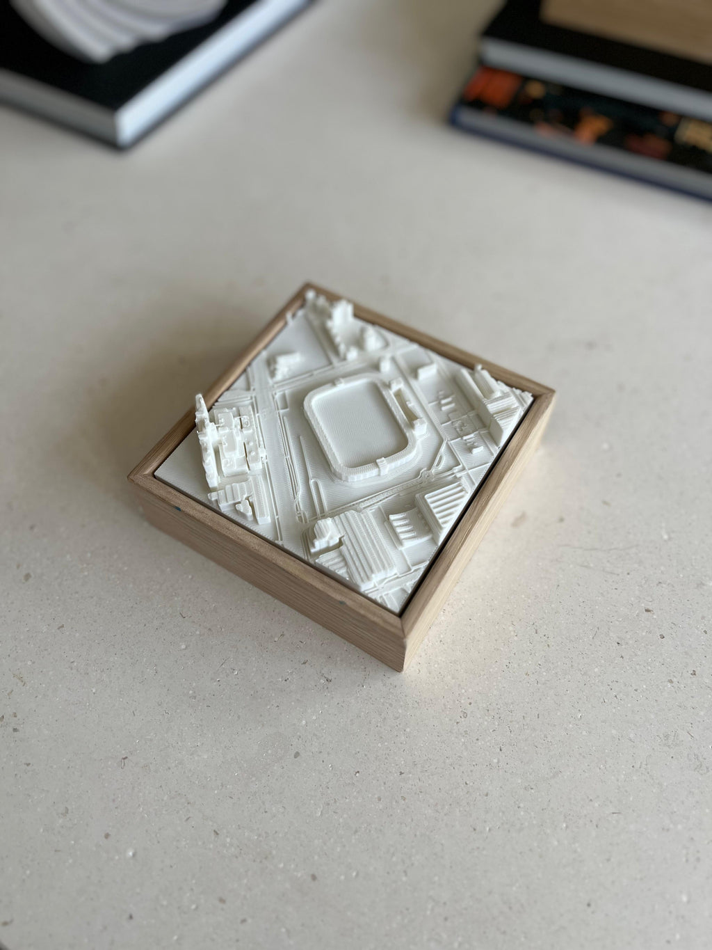 3D city map wall art in a wooden frame on a table, architectural home decor